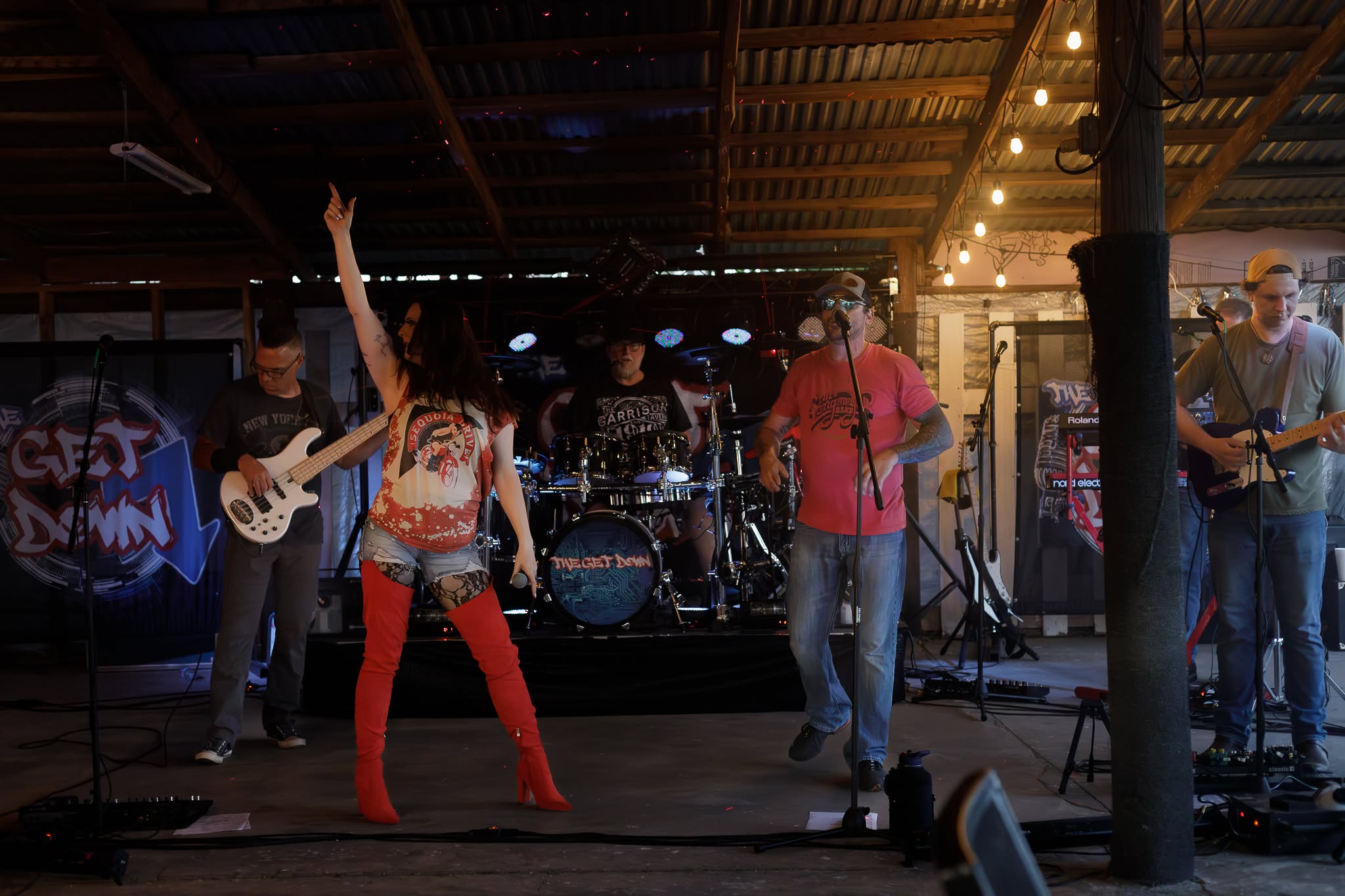 A live band performing at an Overtime Bar & Grill event